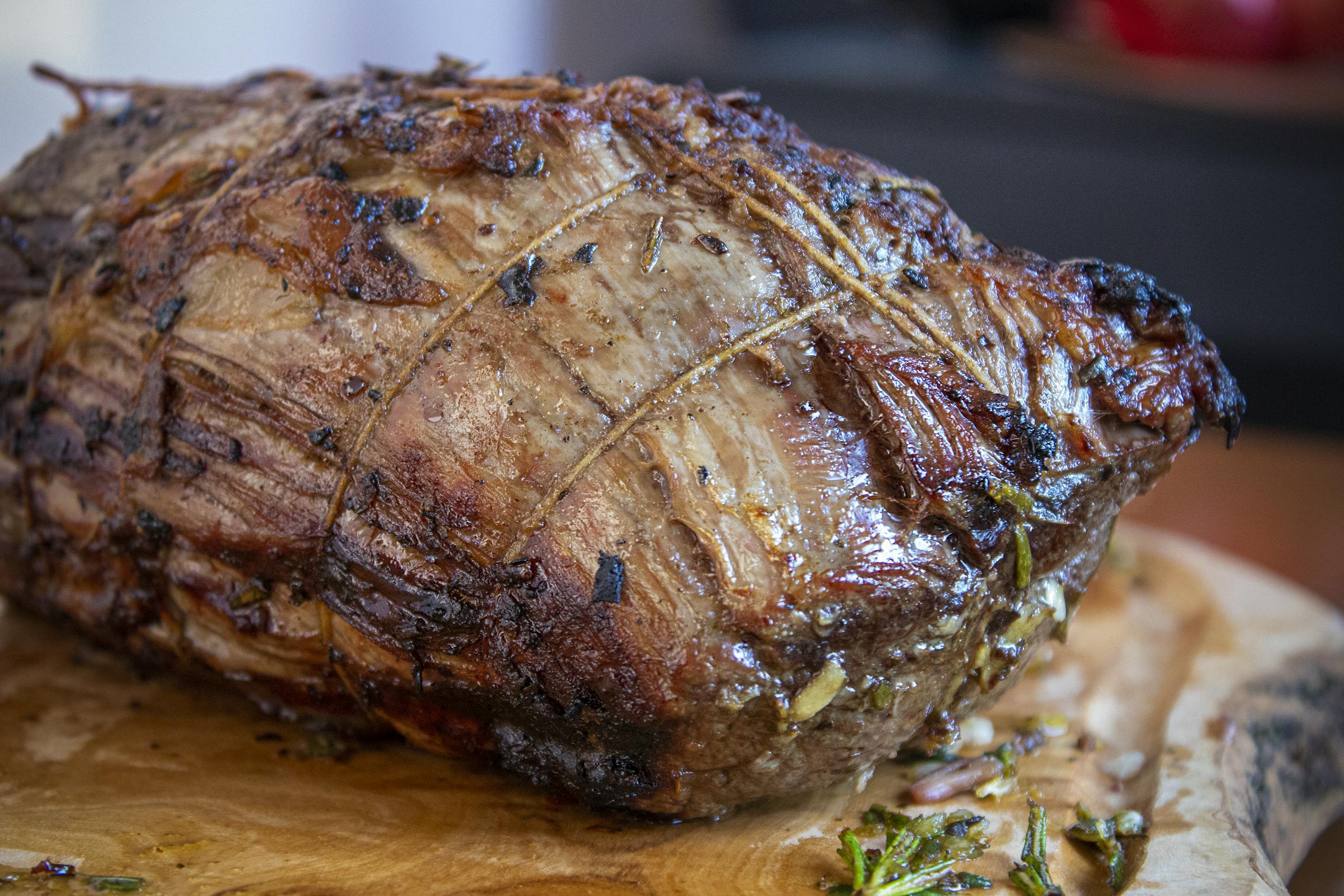 Deliciously roasted beef seasoned with herbs, perfect for festive gatherings.